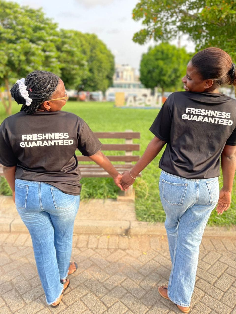 Frannys Tidy Solutions team members smiling in branded shirts outdoors